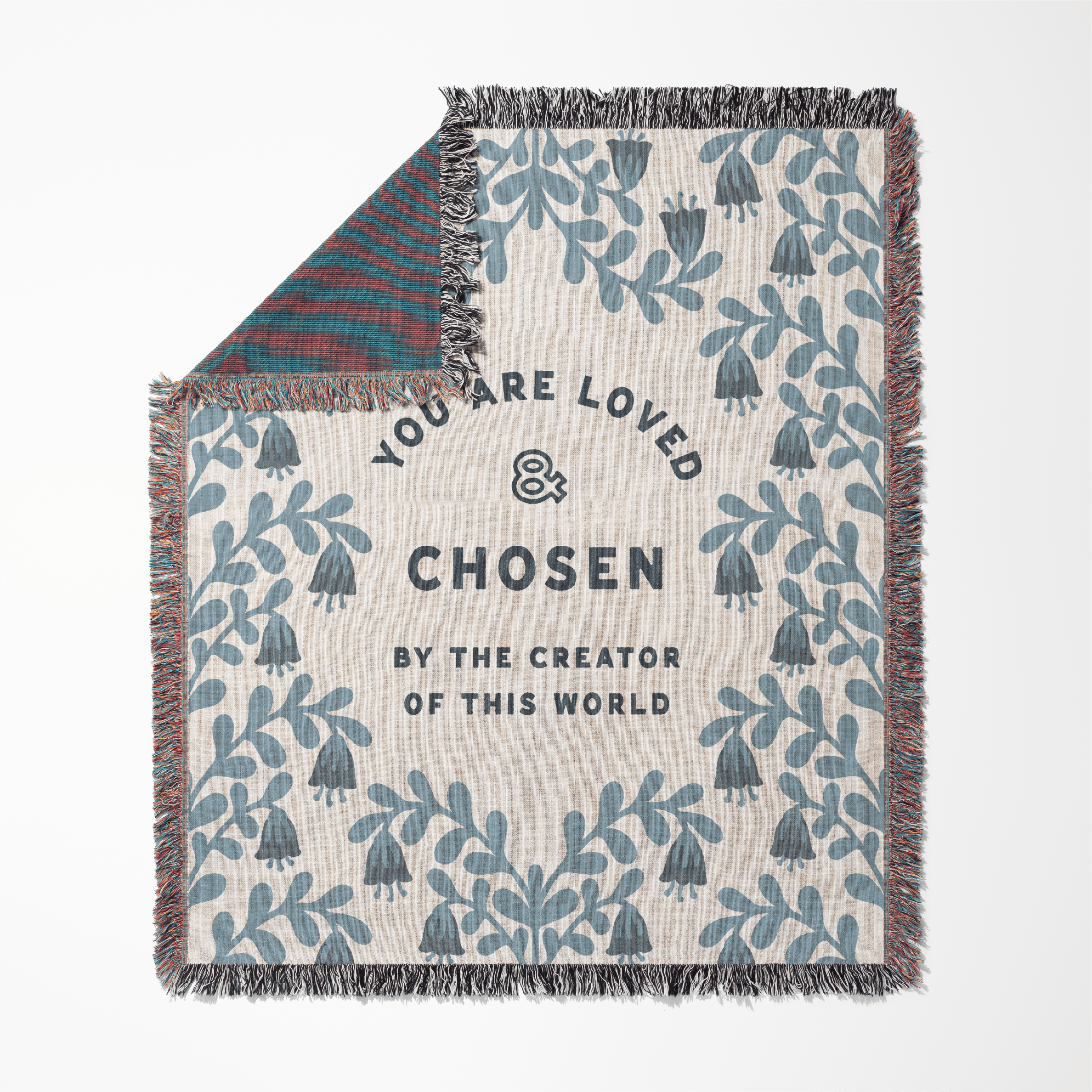 Blanket with text 'You are loved and chosen by the creator of this world' and leaf pattern