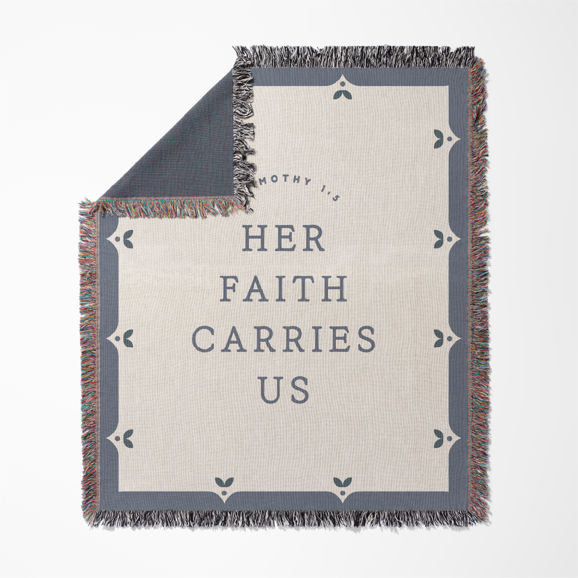 Blanket with 'Her Faith Carries Us' text on a white background