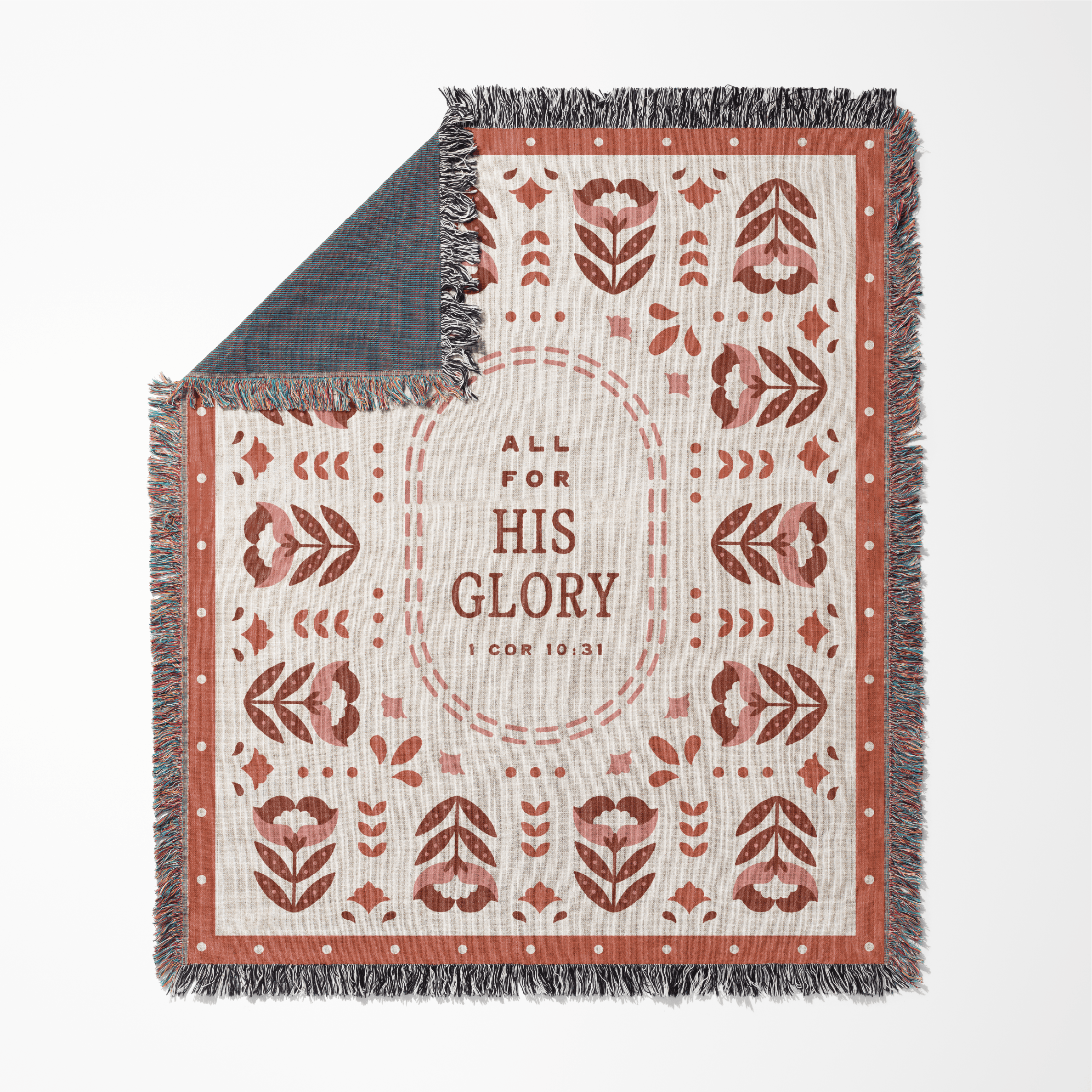 Decorative blanket with floral patterns and 'All for His Glory' text on a white background