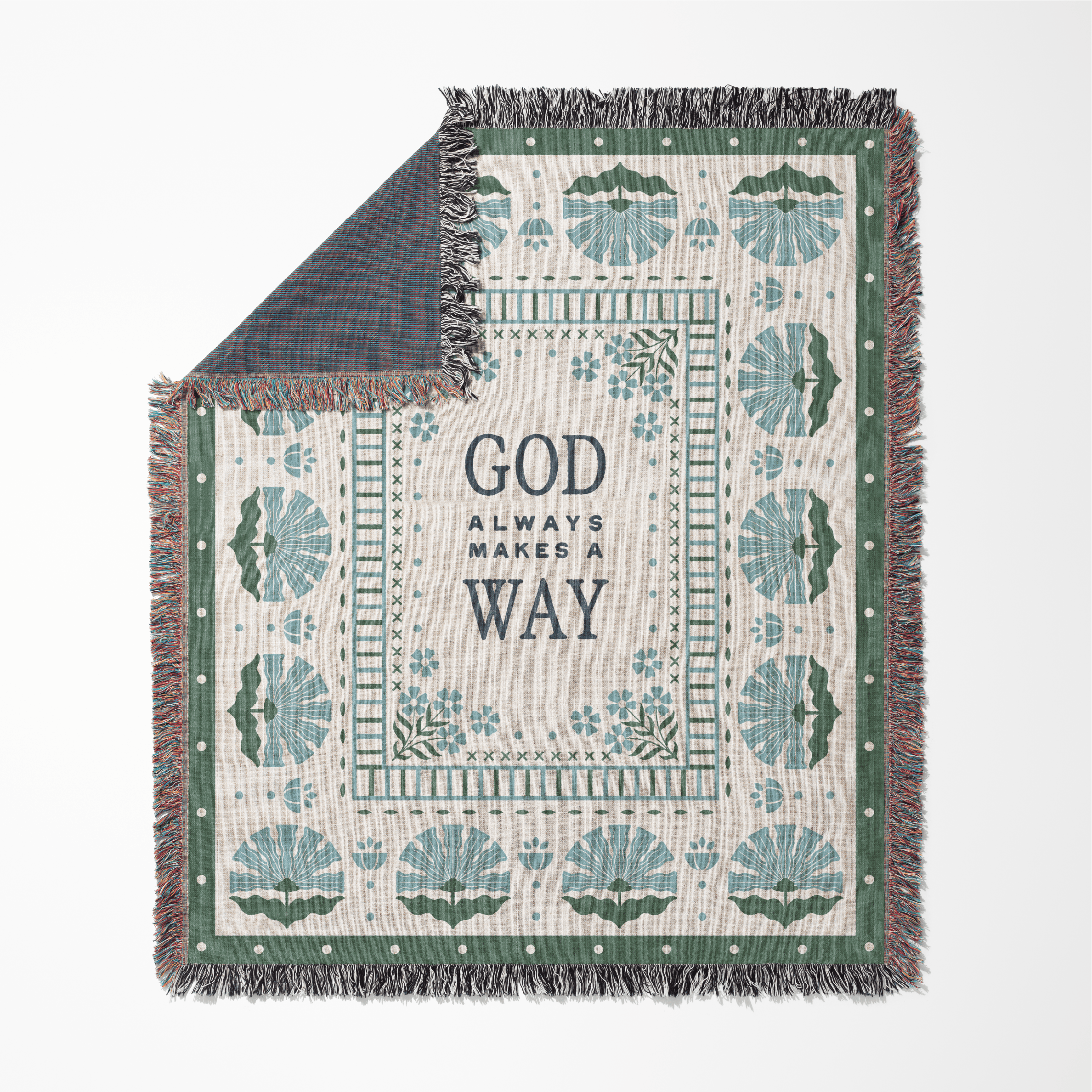Decorative throw blanket with text and patterns on a white background