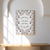 Framed motivational quote on a wall with decorative elements