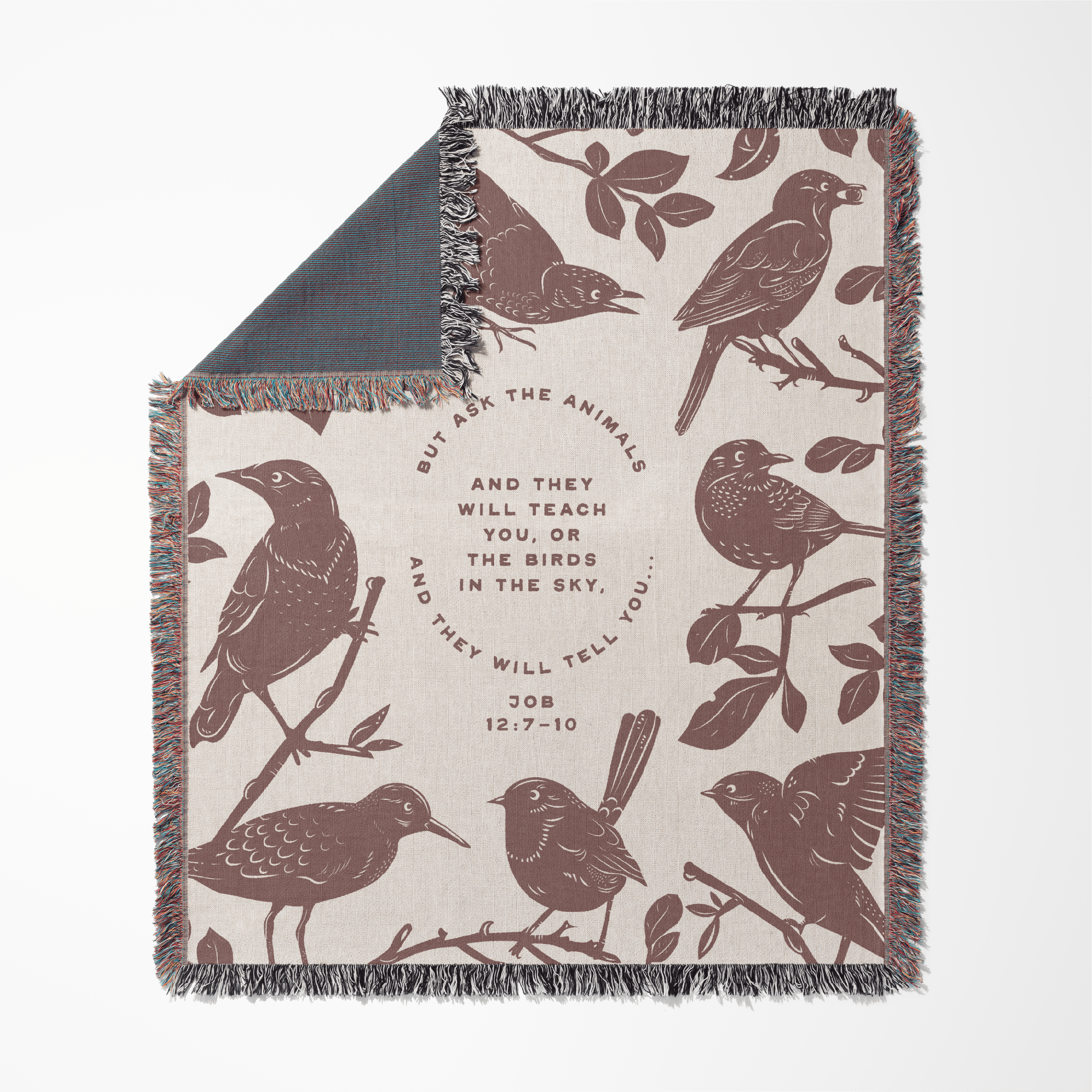 Blanket with bird pattern and text on a white background