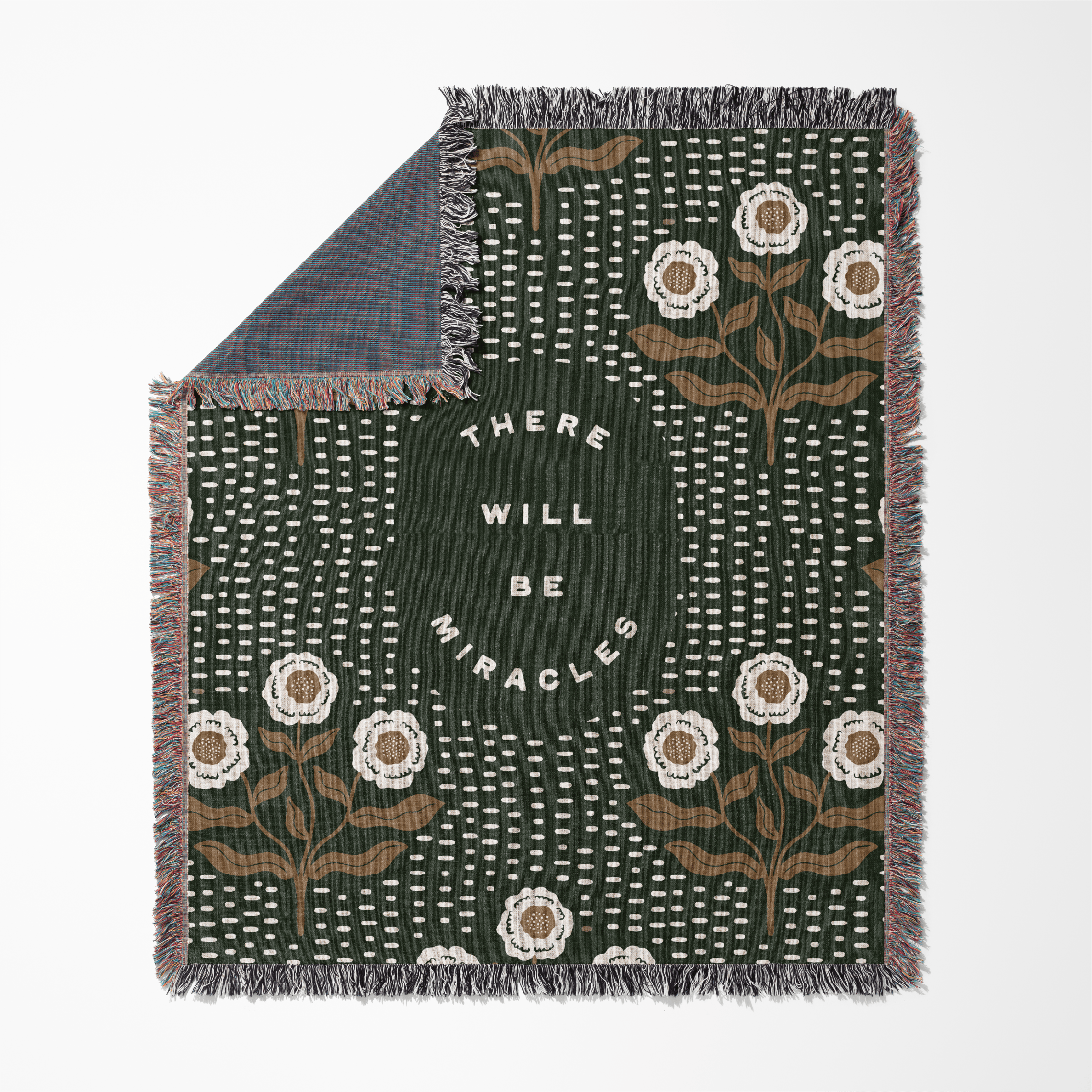 Blanket with floral pattern and motivational text on a white background