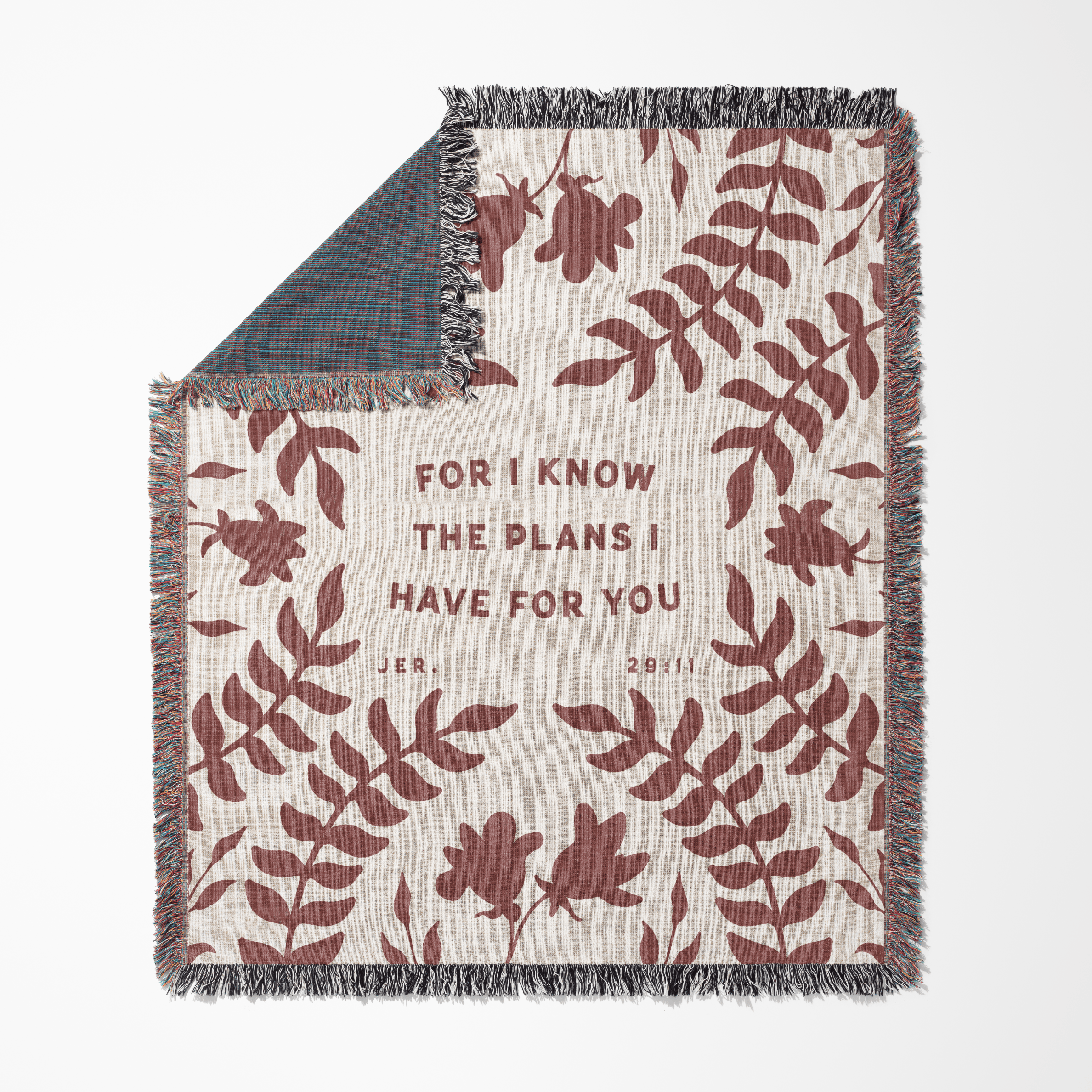 Blanket with leaf pattern and text 'For I know the plans I have for you' on a white background