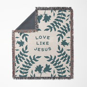 Blanket with leaf pattern and 'Love Like Jesus' text on a white background
