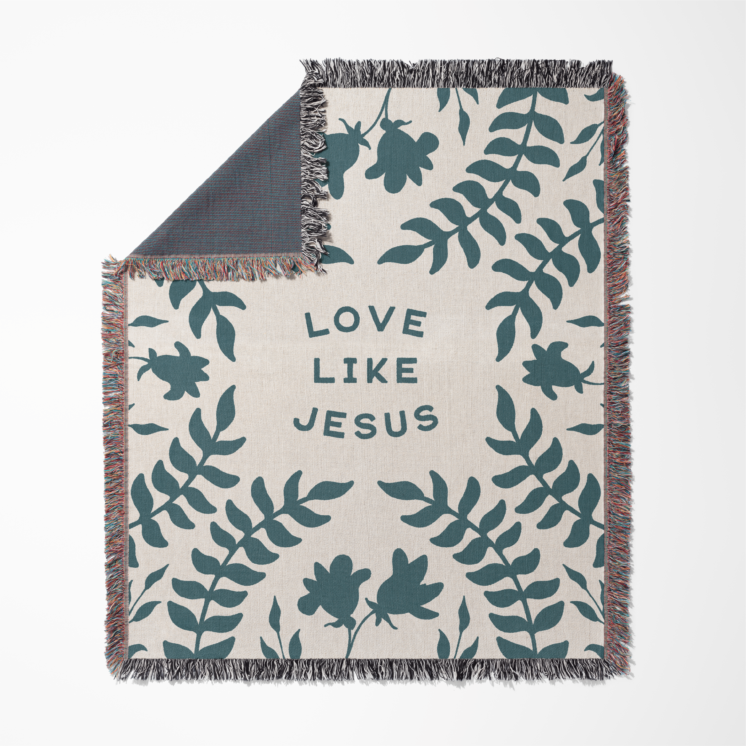 Blanket with leaf pattern and 'Love Like Jesus' text on a white background