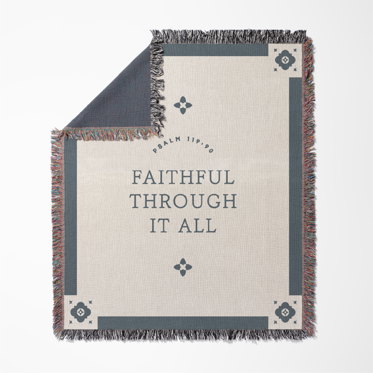 Blanket with 'Faithful Through It All' text and decorative patterns on a white background