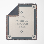 Blanket with 'Faithful Through It All' text and decorative patterns on a white background