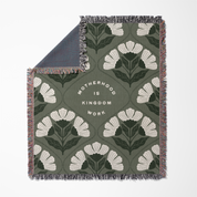 Floral patterned throw blanket with text on a white background