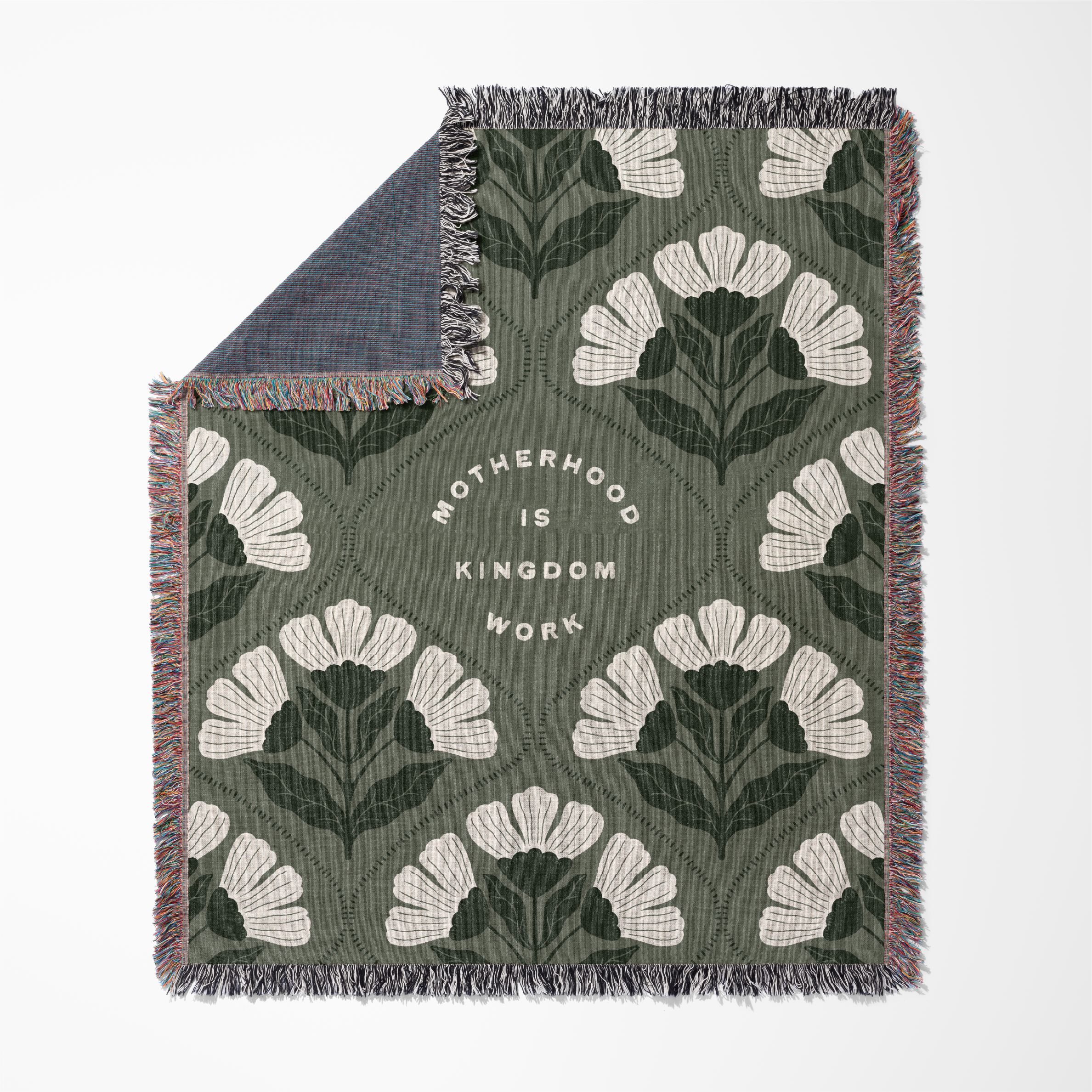 Floral patterned throw blanket with text on a white background