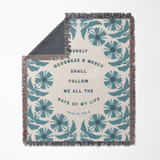 Floral patterned blanket with text on a white background