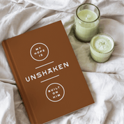 Brown notebook with white text on a white background