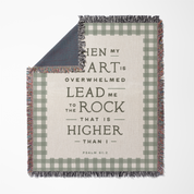 Blanket with motivational quote and plaid pattern on a white background