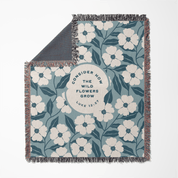 Floral patterned blanket with text on a white background