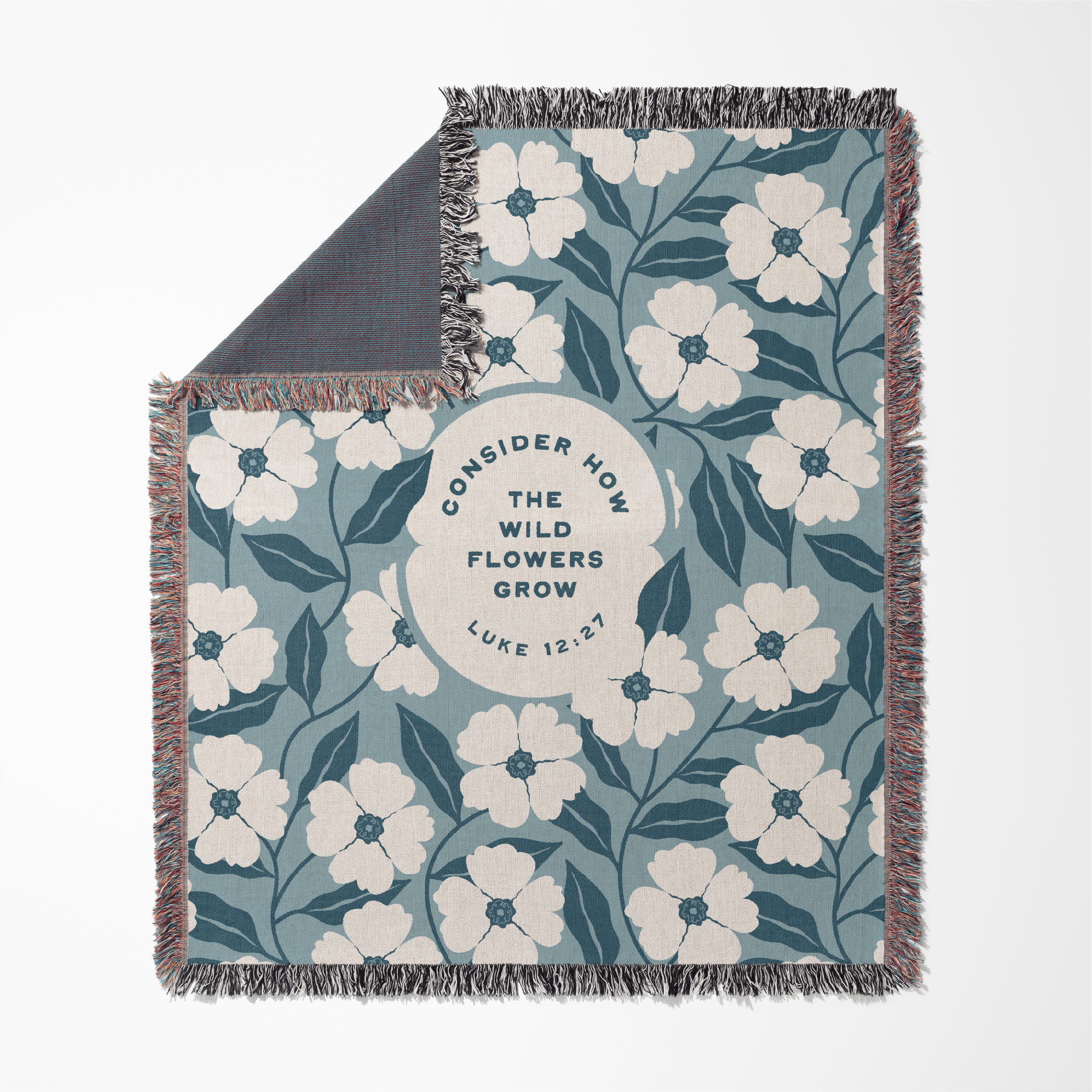 Floral patterned blanket with text on a white background