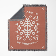Blanket with floral design and 'Lord is my Shepherd' text on a white background