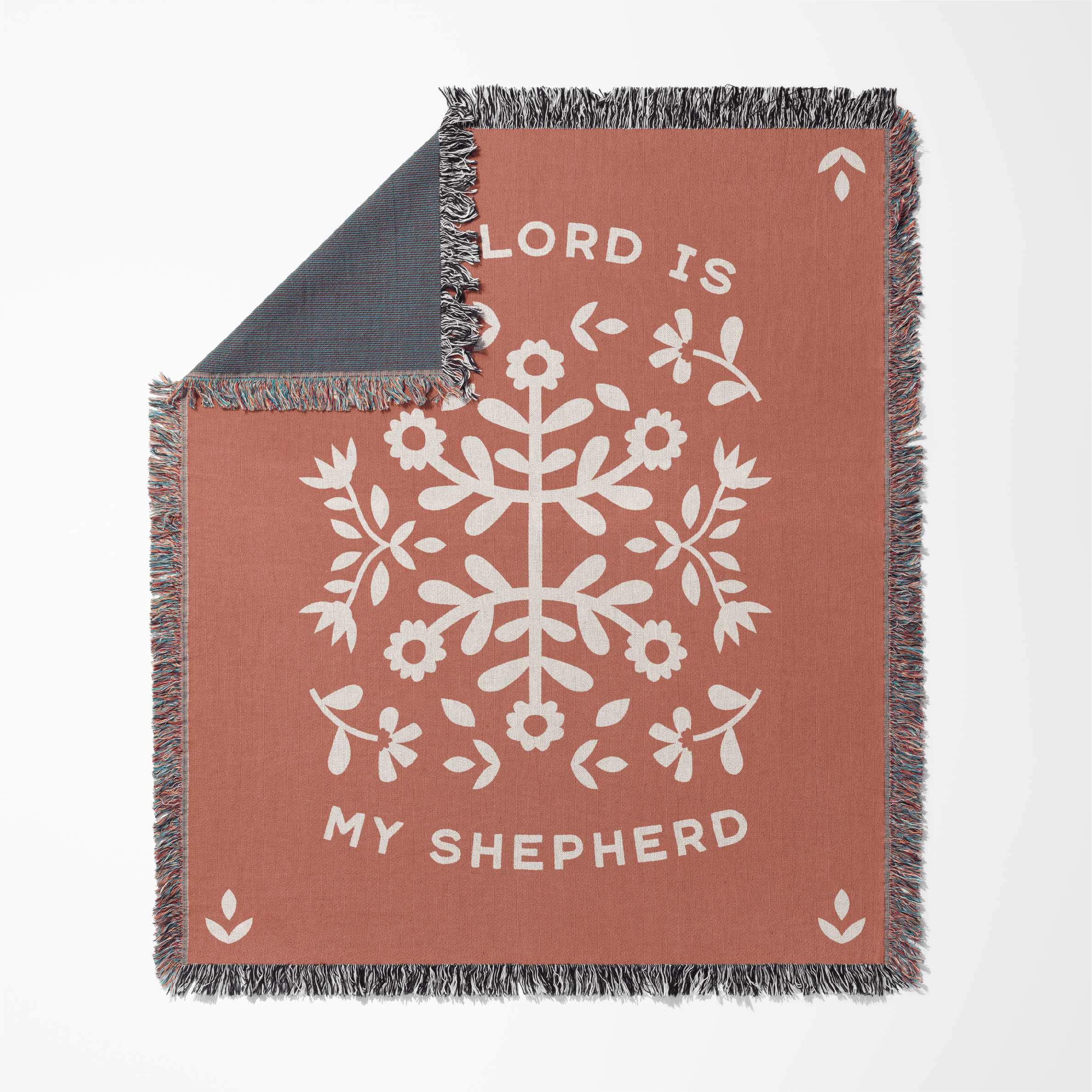 Blanket with floral design and 'Lord is my Shepherd' text on a white background