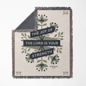 Blanket with floral design and motivational quote on a white background