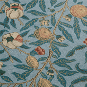 Patterned fabric with pomegranate design on a blue background