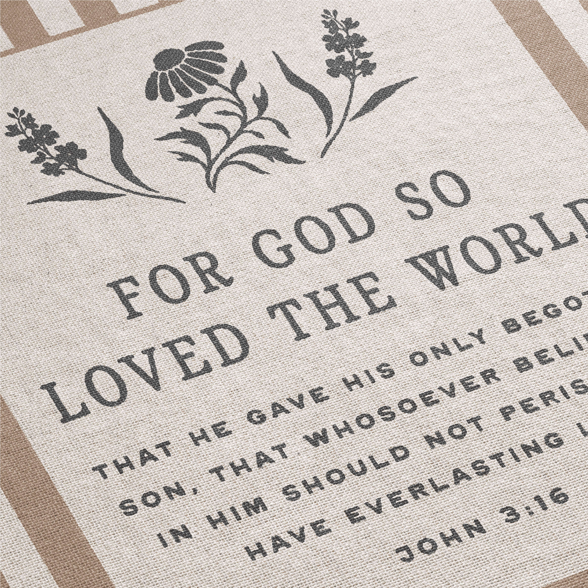 Textile with floral design and Bible verse 'For God so loved the world' on a beige background