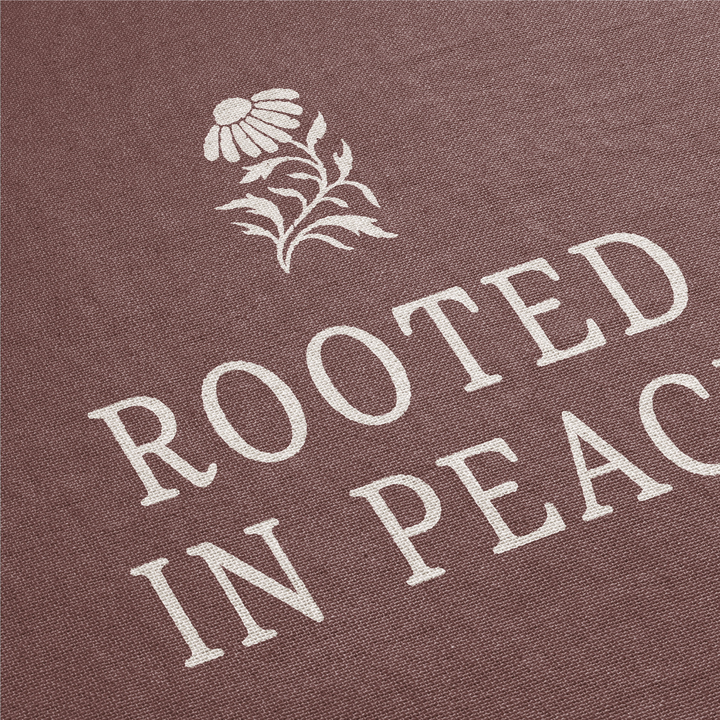 Text 'Rooted in Peace' with a flower design on a brown background