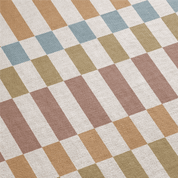 Checkered pattern with brown, beige, and blue squares on a textured surface.