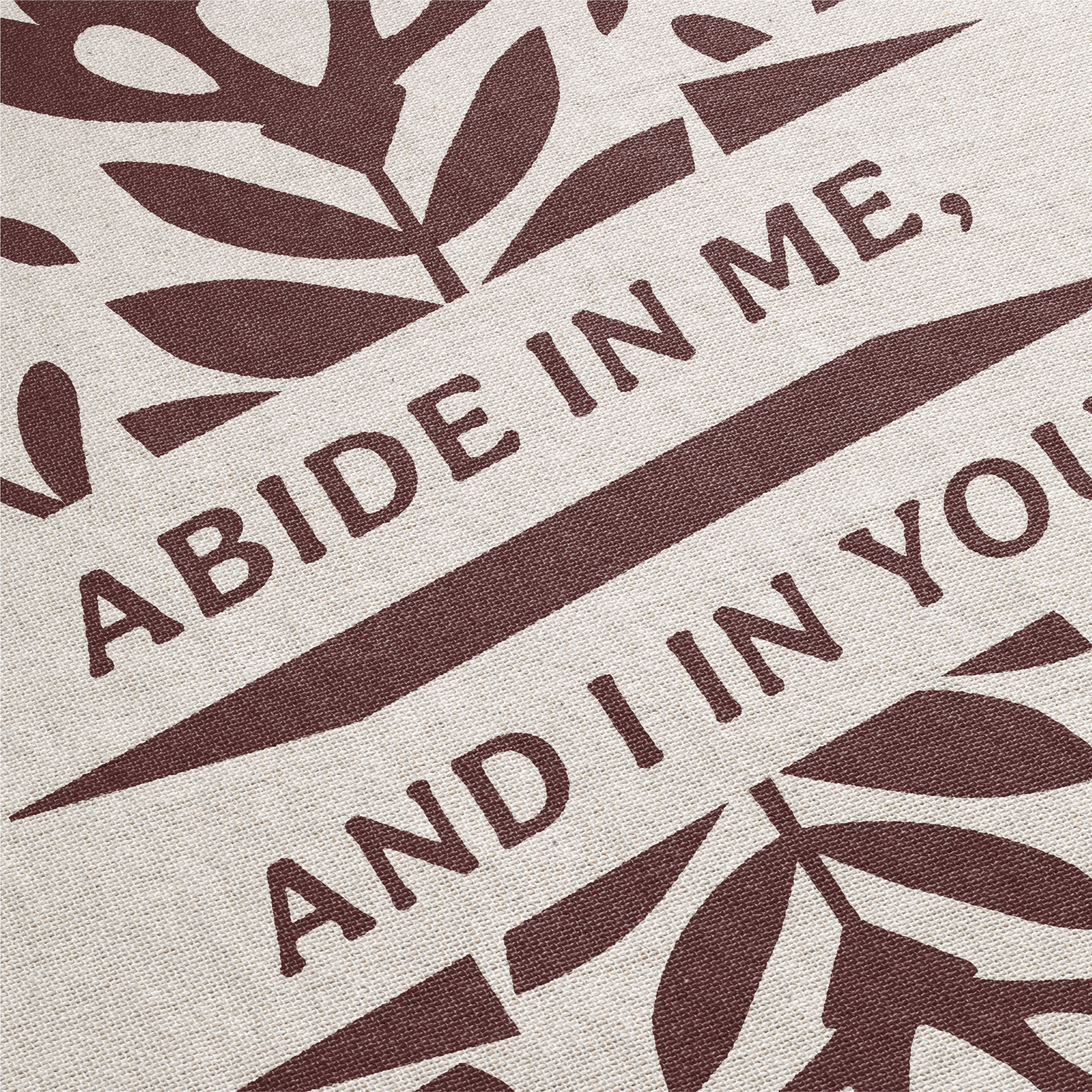 Text 'Abide in me, and I in you' with leaf patterns on a beige background