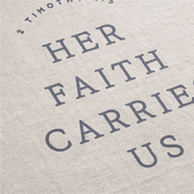 Text on a textured fabric background with 'Her Faith Carries Us' and '2 Timothy 3:16'.