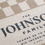 Personalized rug with 'The Johnson Family' text on a checkered background