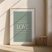 Framed poster with motivational quote on a wall with a wooden stool.