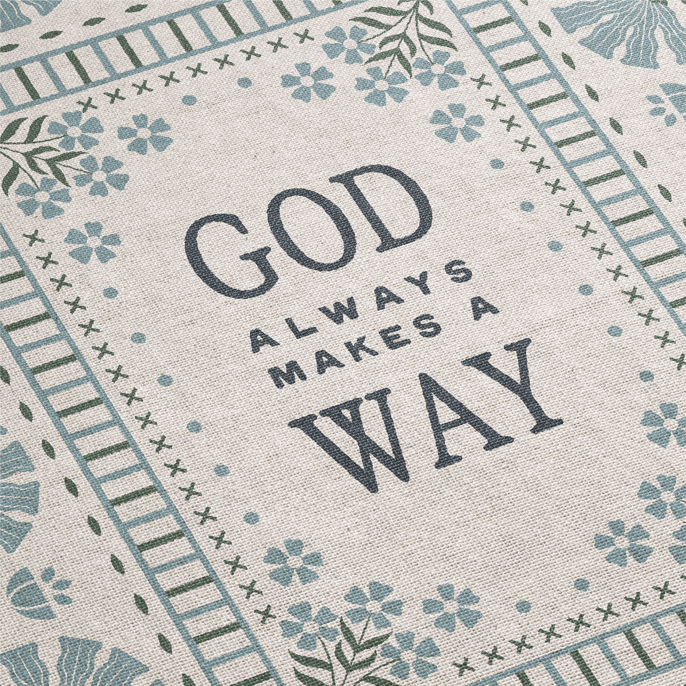 Textile with 'God always makes a way' quote and decorative border