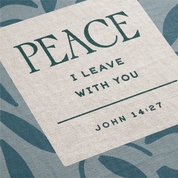 Textile with 'PEACE I LEAVE WITH YOU' quote from John 14:27 on a leaf patterned background