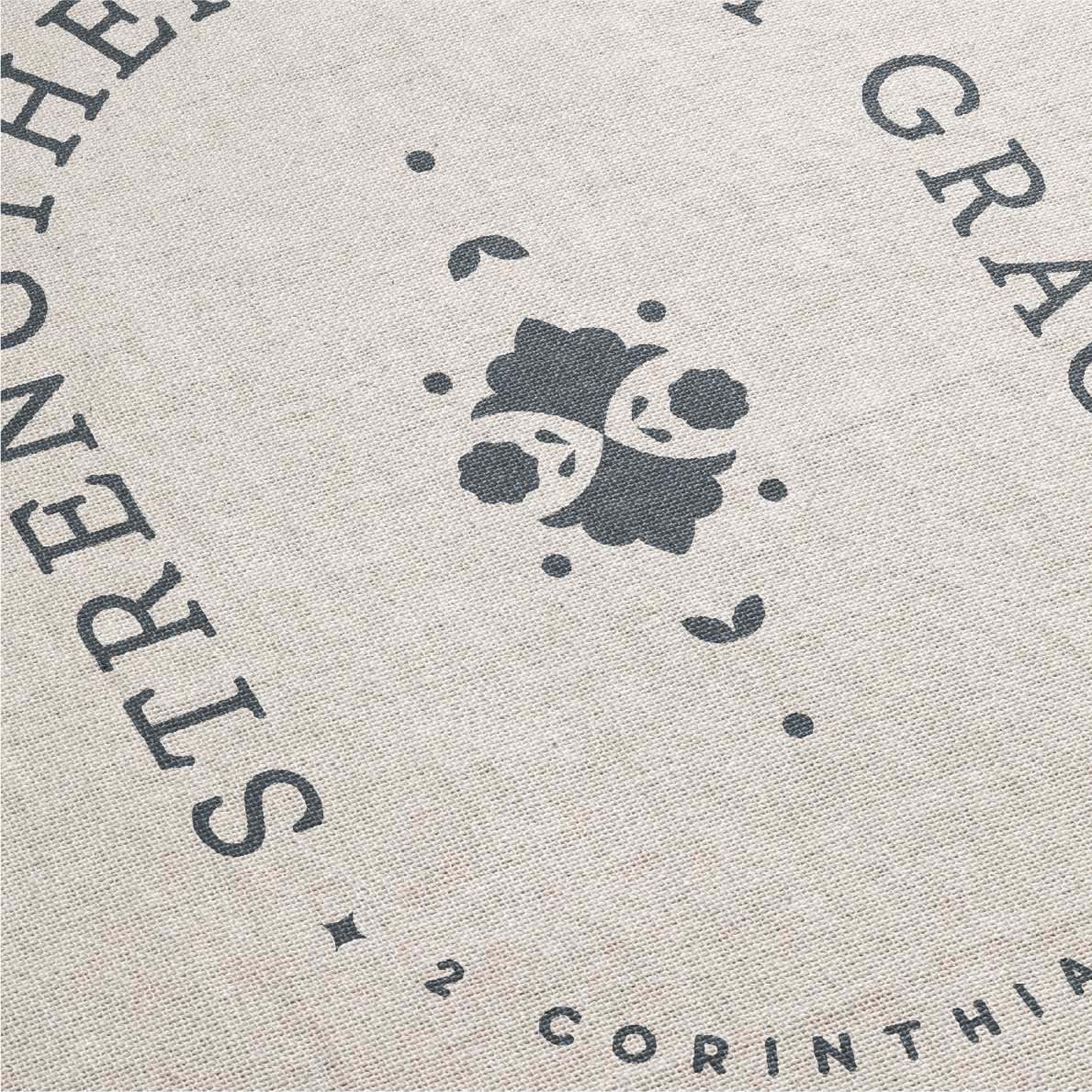 Textured fabric with printed design and text on a neutral background