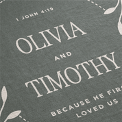Personalized fabric with names 'Olivia' and 'Timothy' and a biblical verse on a gray background.
