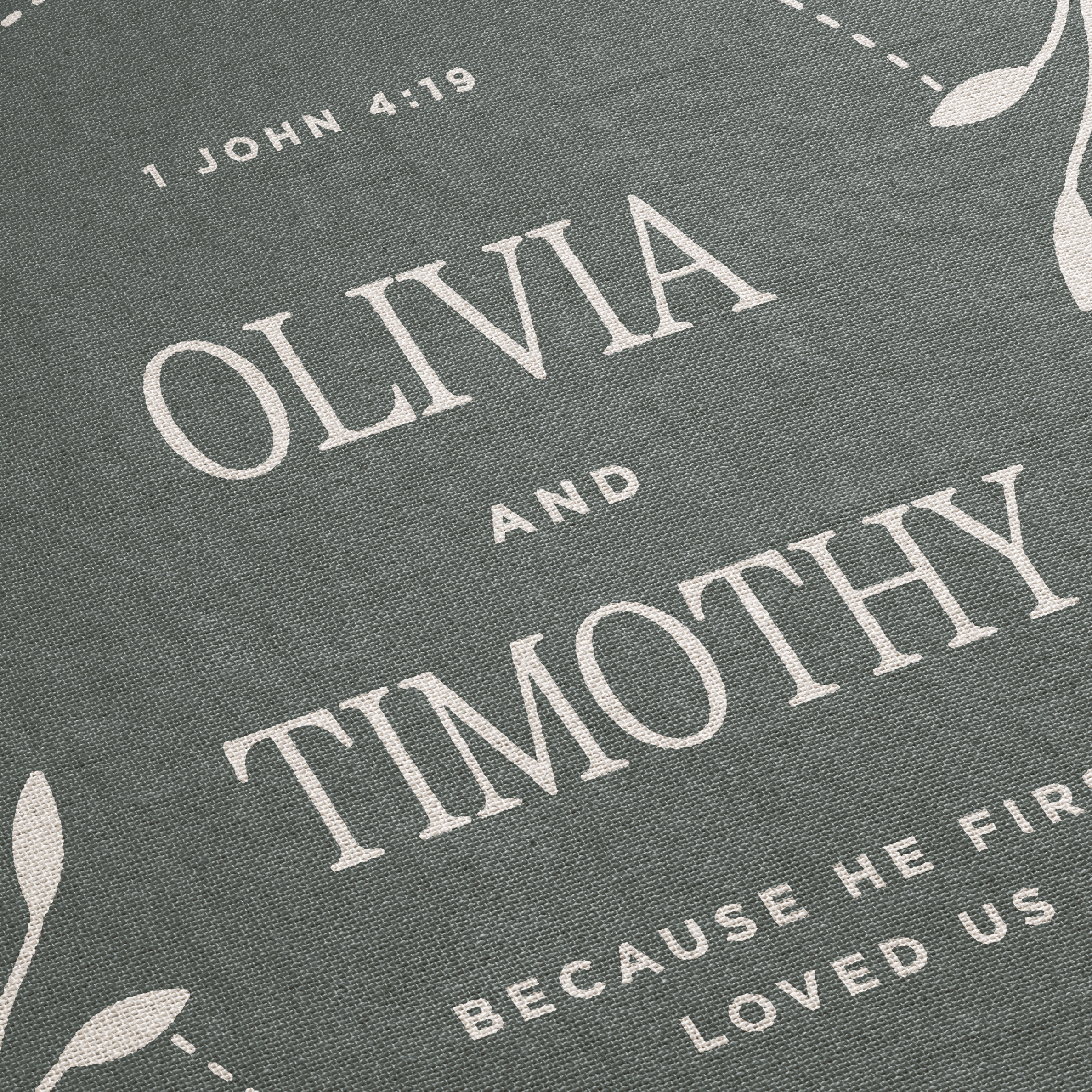 Personalized fabric with names 'Olivia' and 'Timothy' and a biblical verse on a gray background.