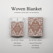 Woven blanket with text and size reference on a light gray background