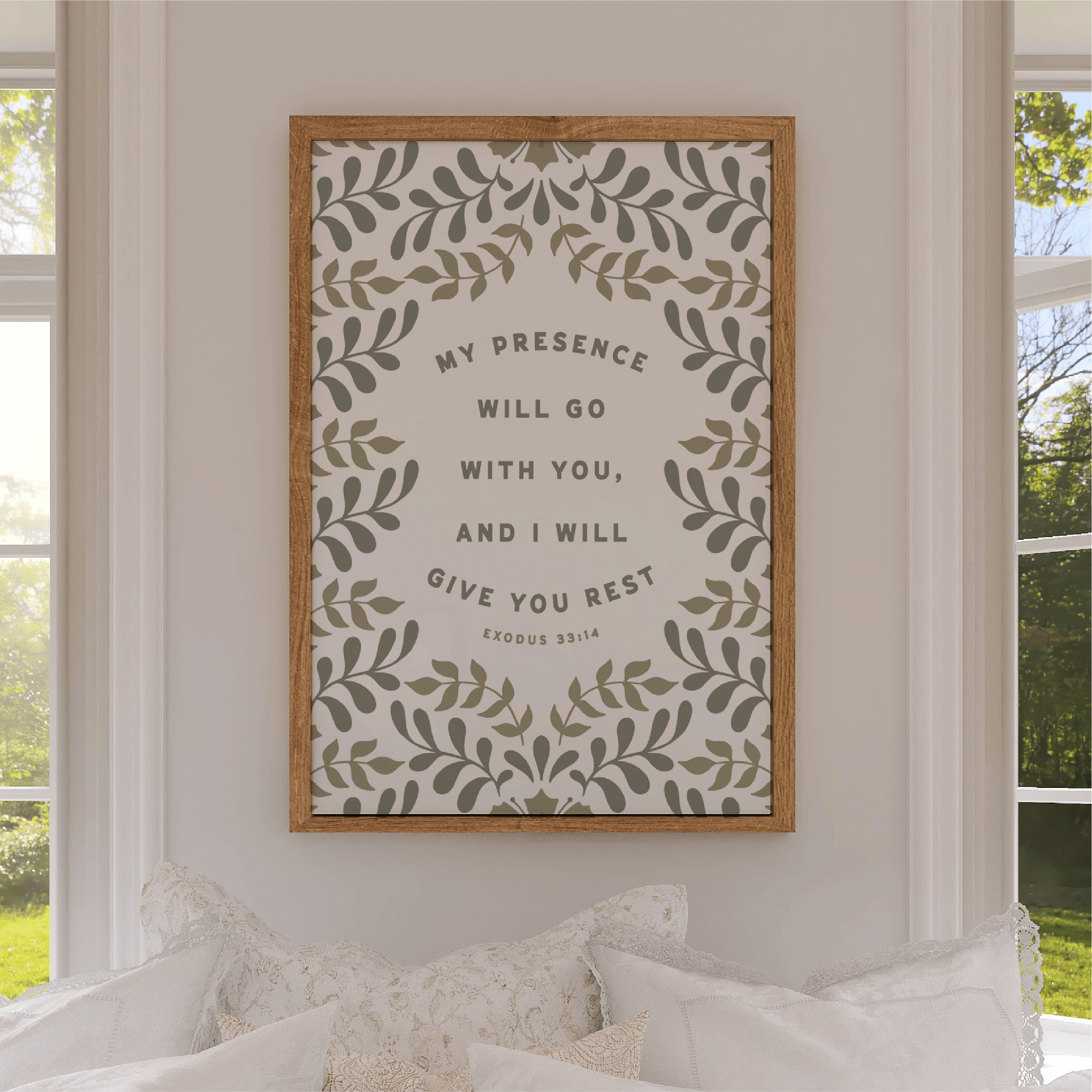 Framed artwork with motivational quote on a wall in a room with windows.