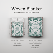 Woven blanket with leaf pattern and text, shown on a bed and sofa for reference sizes.