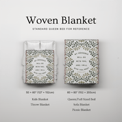 Woven blanket with text design on a light gray background