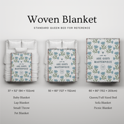 Woven blanket with various sizes displayed on a standard queen bed for reference.