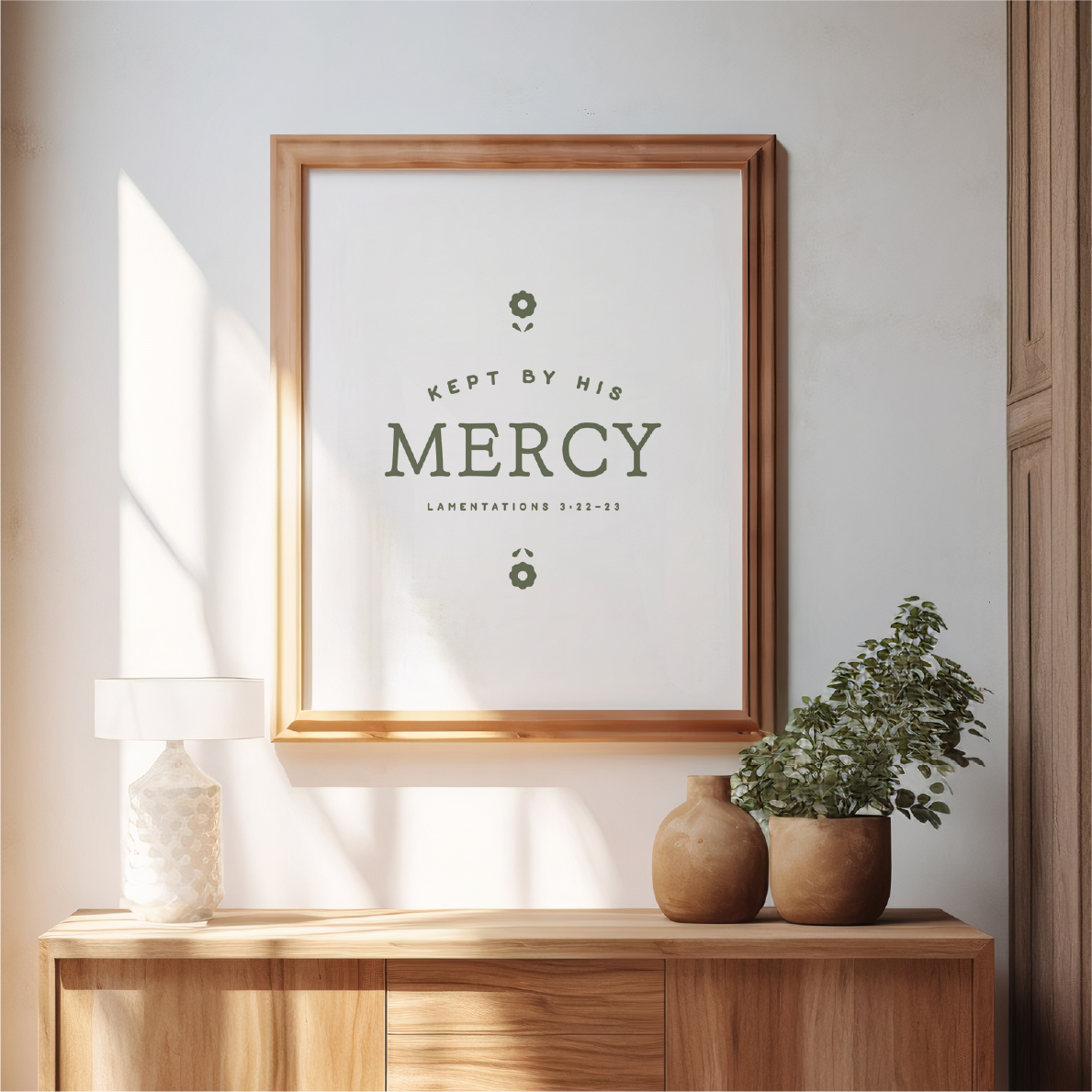 Framed print with motivational quote on a wall above a wooden console table.