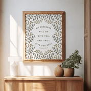 Framed artwork with motivational quote on a wall above a wooden console table.