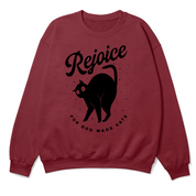 Red sweatshirt with black cat graphic and 'Rejoice' text on a white background