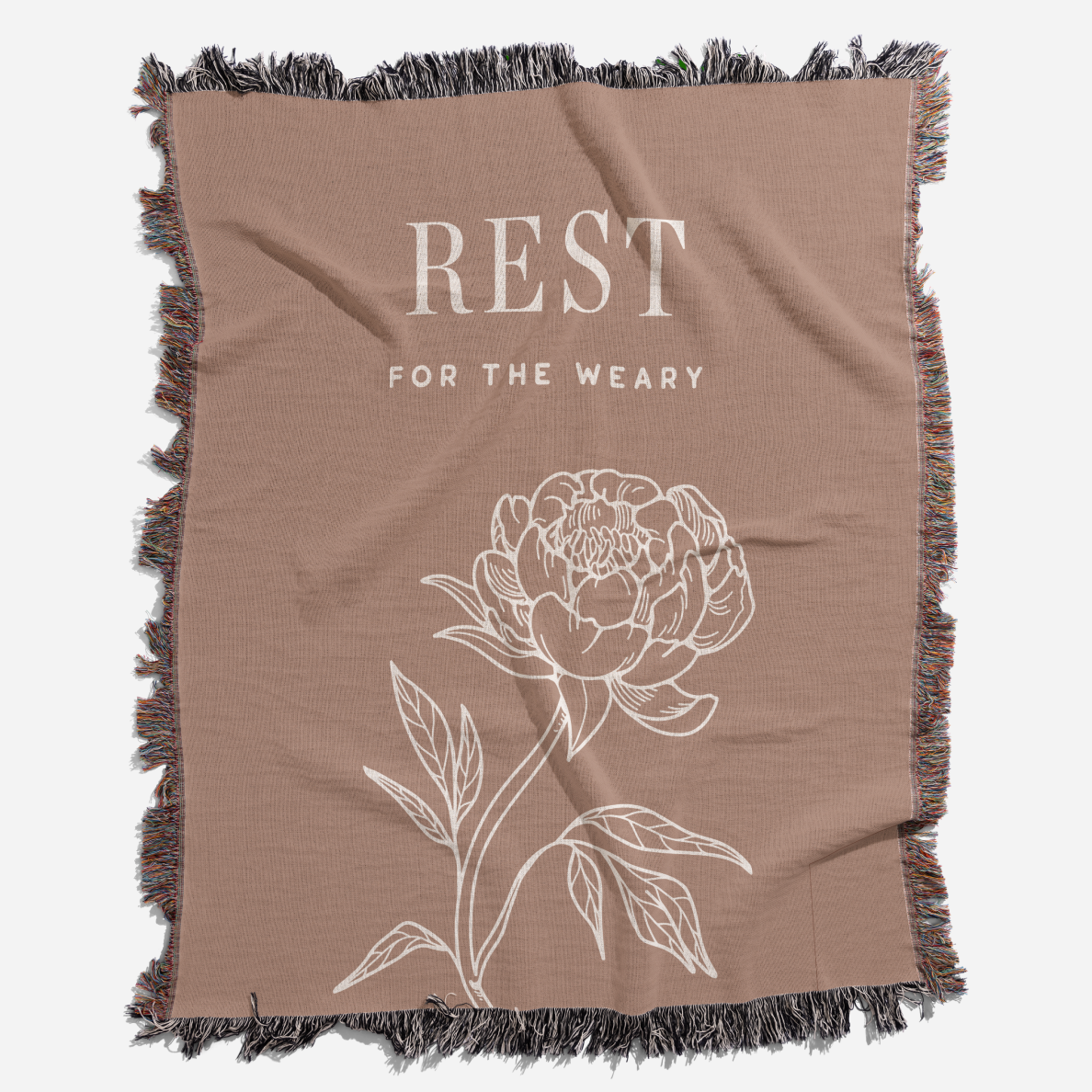 Brown blanket with floral design and text 'REST FOR THE WEARY' on a white background