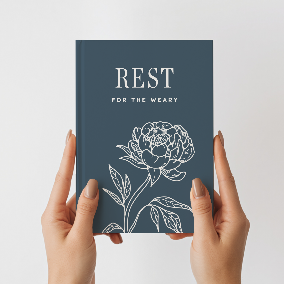 Book titled 'Rest for the Weary' with a floral design on a white background