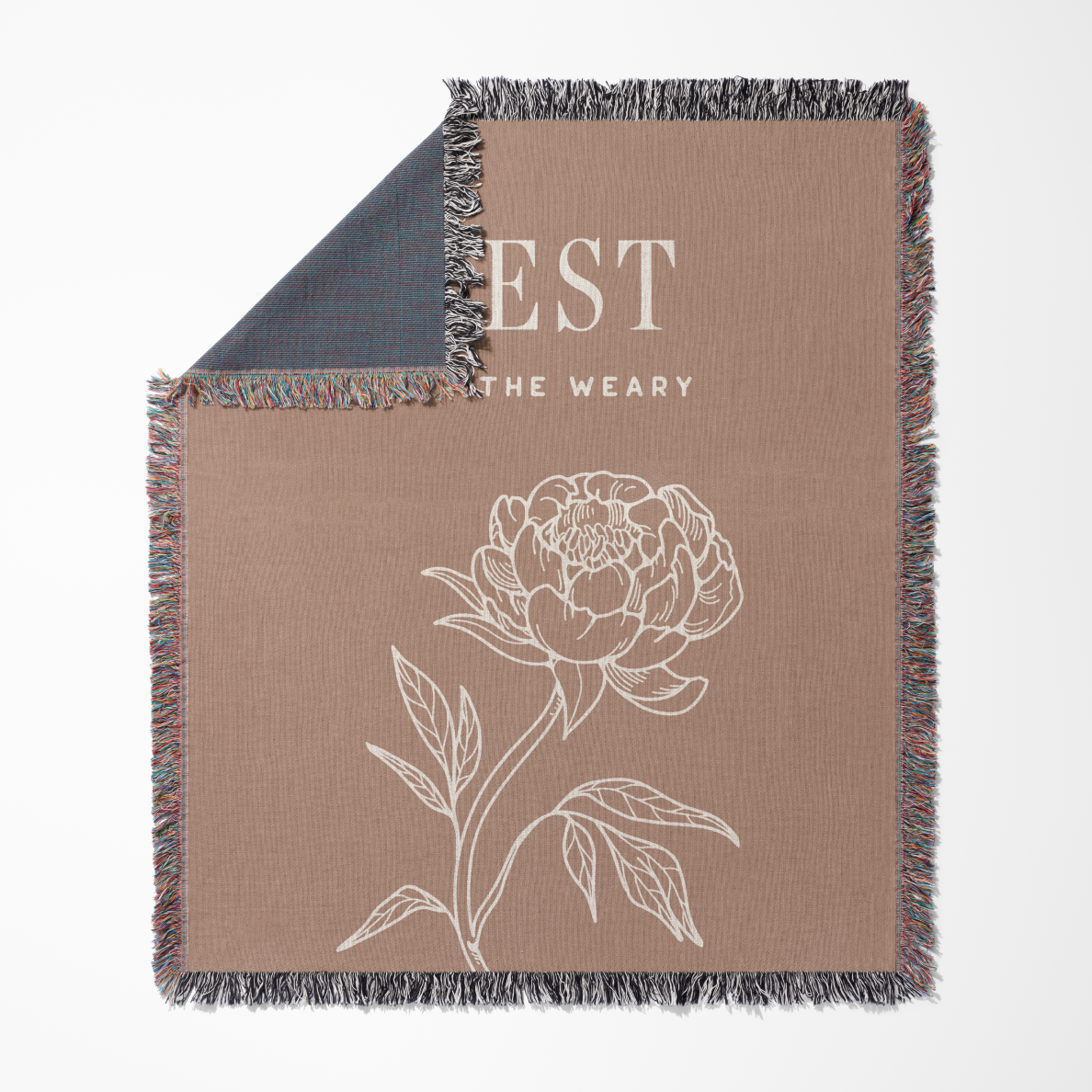 Blanket with floral design and text on a beige background