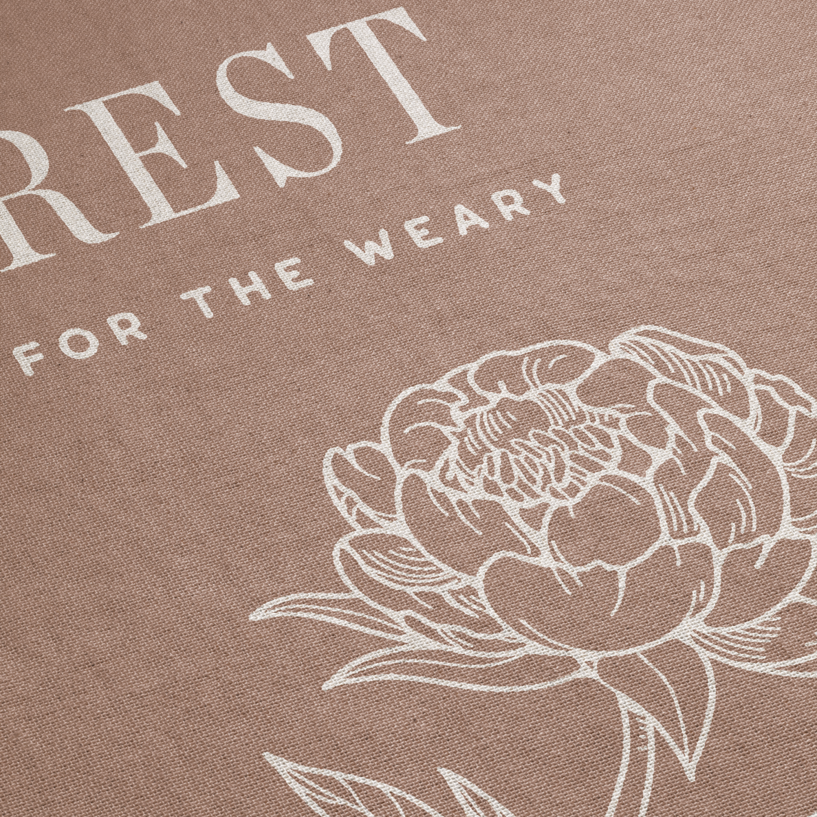 Brown fabric with white floral design and text 'REST FOR THE WEARY'.