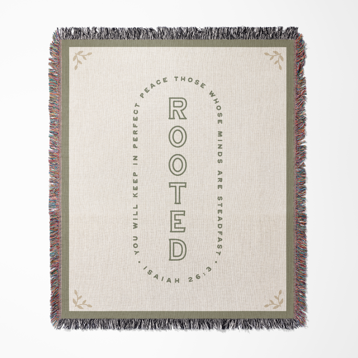 Blanket with text 'Rooted' and Isaiah 26:3 quote on a white background