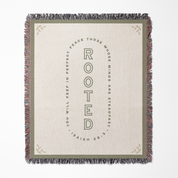 Blanket with text 'Rooted' and Isaiah 26:3 quote on a white background