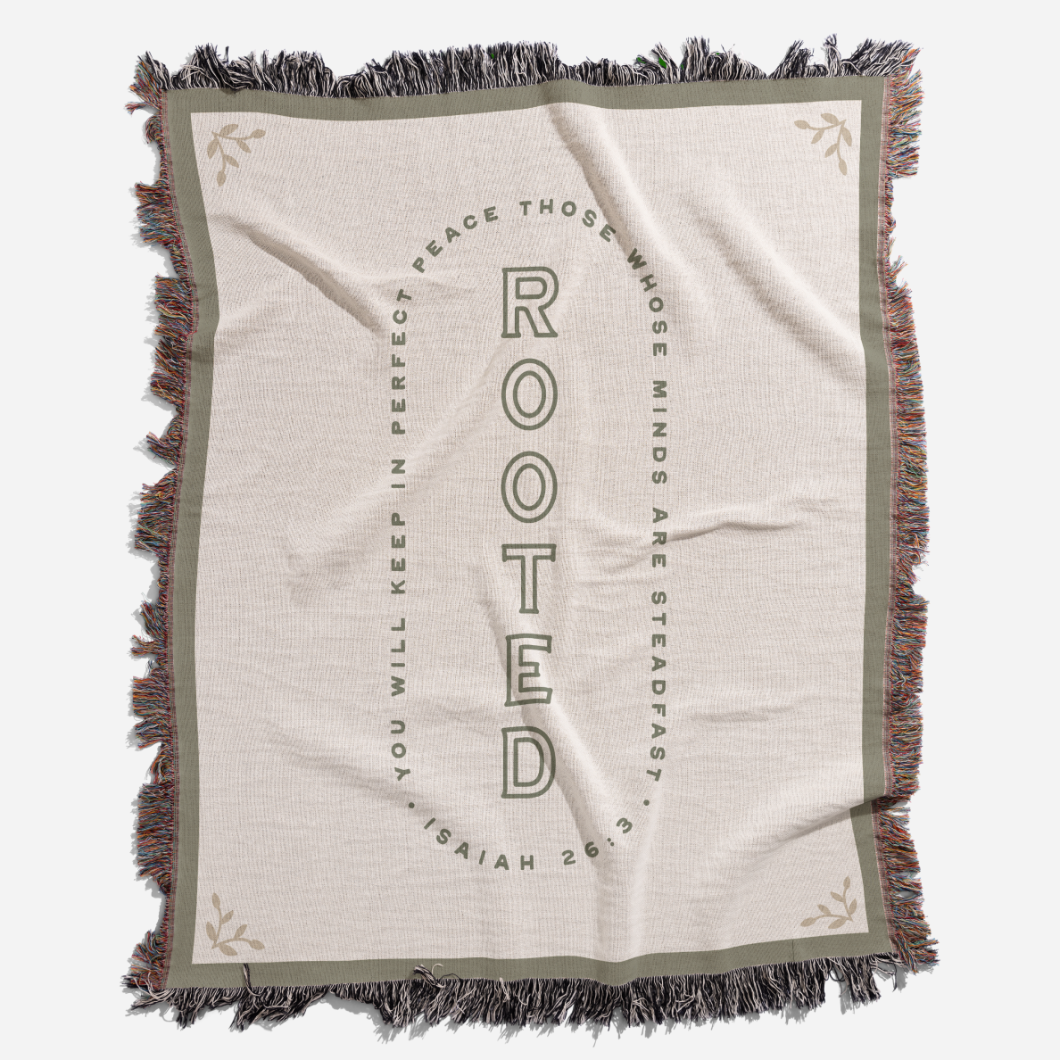 Blanket with 'Rooted' text and fringes on a white background